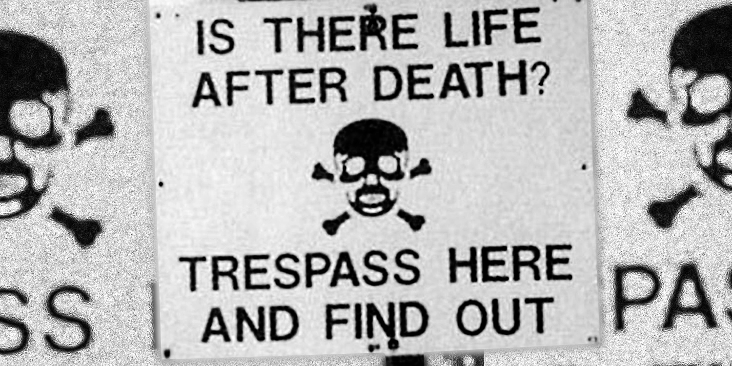 Sign reading "Is there life after death? Trespass here and find out."